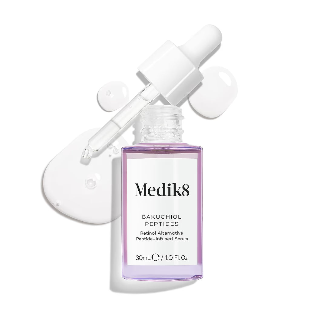 Medik8 skincare serum bottle with dropper on a white background