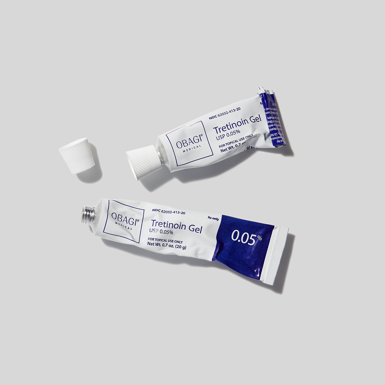 Two tubes of OBAGI Tretinoin Gel on a light gray background