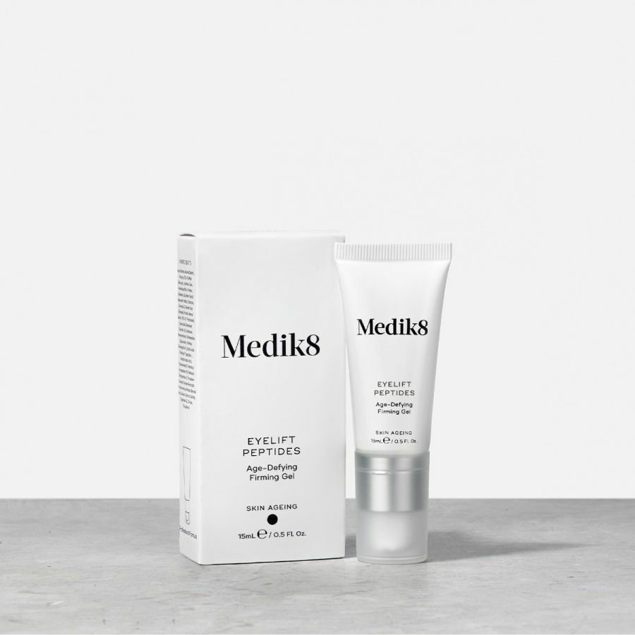 A tube of MEDIK8 EYELIFT PEPTIDES eye cream next to its packaging box, both with the brand name and product details visible.